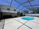 Exterior shot of the inground pool with screened enclosure, concrete patio, and backyard entertainment space at 206 Soldier Ct, Seffner, FL 33584
