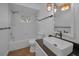 Updated bathroom with tub/shower combo, decorative lighting and vanity at 2200 Horan S Way, Gulfport, FL 33707