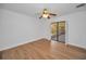 Well-lit bedroom with wood-look floors and an enclosed patio beyond sliding glass doors at 2200 Horan S Way, Gulfport, FL 33707