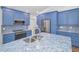 Close-up of kitchen island with stainless steel sink and bright blue granite countertops at 2200 Horan S Way, Gulfport, FL 33707