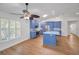 Bright, stylish kitchen with blue cabinets, granite countertops, stainless appliances, and a sunlit window at 2200 Horan S Way, Gulfport, FL 33707