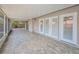 Spacious lanai showcasing decorative tile flooring, access doors and screens for outdoor enjoyment at 2200 Horan S Way, Gulfport, FL 33707