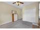 Neutral bedroom features neutral carpet, large closet, ample lighting and a comfortable seating area at 2419 Richmond Greens Ct, Sun City Center, FL 33573
