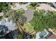 Aerial view of the property with mature trees and neighboring houses with pools and screened in porches at 2925 Starmount Dr, Valrico, FL 33596