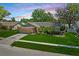 Beautiful single-story home with a lush green lawn, two-car garage, and nicely landscaped front yard at 2925 Starmount Dr, Valrico, FL 33596