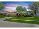 Attractive single-story home with a manicured lawn, a two-car garage, and mature landscaping at 2925 Starmount Dr, Valrico, FL 33596