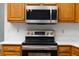 Updated kitchen features stainless steel oven and microwave and light countertops at 2925 Starmount Dr, Valrico, FL 33596
