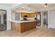 Open concept living space featuring eat-in kitchen island and stainless appliances at 2925 Starmount Dr, Valrico, FL 33596