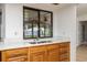 Kitchen with stainless steel sink, white countertops, and view of backyard at 2925 Starmount Dr, Valrico, FL 33596