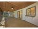 Covered patio features tile flooring, two ceiling fans, and a convenient pass-through window to the interior at 2925 Starmount Dr, Valrico, FL 33596