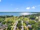 Wide aerial view of the neighborhood park with lush greenery, trees, and waterfront views at 303 National Orange Ave, Oldsmar, FL 34677