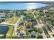 An aerial view showing the property's location near a body of water and park at 303 National Orange Ave, Oldsmar, FL 34677