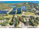 An aerial view of the home and neighborhood, showcasing proximity to the local waterways at 303 National Orange Ave, Oldsmar, FL 34677