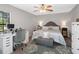 Cozy bedroom with a workspace, comfortable furniture and a soft area rug at 303 National Orange Ave, Oldsmar, FL 34677
