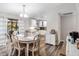 Charming dining room area with stylish furniture, and plenty of natural light at 303 National Orange Ave, Oldsmar, FL 34677
