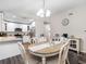 Inviting dining area with a table for six and seamless flow to the kitchen at 303 National Orange Ave, Oldsmar, FL 34677