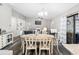 Open-concept dining room features a large table, chairs, and seamless flow to the living area at 303 National Orange Ave, Oldsmar, FL 34677