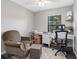 Home office with a desk, chair, and window for natural light at 303 National Orange Ave, Oldsmar, FL 34677