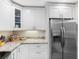 Modern kitchen features stainless steel appliances, white cabinets, and lots of storage at 303 National Orange Ave, Oldsmar, FL 34677