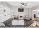 Cozy living room with built-in shelving, a fireplace, and stylish decor throughout at 303 National Orange Ave, Oldsmar, FL 34677