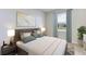 Comfortable bedroom features stylish decor, plush bedding, and serene ambiance for relaxation at 3318 Amber Waves Dr, Plant City, FL 33565