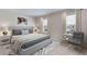 Inviting bedroom offers soft lighting, comfortable bedding, and window views for a relaxing retreat at 3318 Amber Waves Dr, Plant City, FL 33565