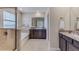 Main bathroom featuring double vanity, glass shower, soaking tub, tile flooring and ample lighting at 3318 Amber Waves Dr, Plant City, FL 33565