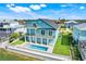 Breathtaking aerial view showcasing waterfront home with multiple balconies and a refreshing pool at 3496 Amberjack Dr, Hernando Beach, FL 34607