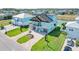 Aerial view of a two-story home with manicured lawn and waterfront access at 3496 Amberjack Dr, Hernando Beach, FL 34607