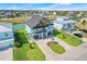 Aerial view of a two-story home with manicured lawn, waterfront access and canal view at 3496 Amberjack Dr, Hernando Beach, FL 34607