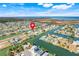 Aerial view of waterfront homes and community waterways, showcasing ideal coastal living with expansive views and easy water access at 3496 Amberjack Dr, Hernando Beach, FL 34607