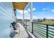 Waterfront balcony is furnished with chairs and overlooks the canal at 3496 Amberjack Dr, Hernando Beach, FL 34607