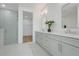 Bright bathroom with dual vanity, quartz countertop, and walk-in shower with glass door at 3496 Amberjack Dr, Hernando Beach, FL 34607