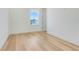 Bright and airy bedroom with hardwood floors and a large window at 3496 Amberjack Dr, Hernando Beach, FL 34607