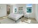 Comfortable bedroom with natural light, neutral decor, and a view of the neighborhood at 3496 Amberjack Dr, Hernando Beach, FL 34607
