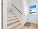 A light and bright entryway features a staircase and outdoor access at 3496 Amberjack Dr, Hernando Beach, FL 34607
