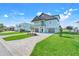 Charming two-story home with a two-car garage and a brick-paved driveway at 3496 Amberjack Dr, Hernando Beach, FL 34607