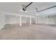 Spacious garage with multiple support columns, bright lighting, and neutral walls at 3496 Amberjack Dr, Hernando Beach, FL 34607