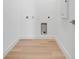 Minimalist laundry room, ready for appliance hookups, features light wood floors at 3496 Amberjack Dr, Hernando Beach, FL 34607