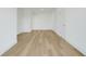 Spacious living room features light wood floors and crisp white trim at 3496 Amberjack Dr, Hernando Beach, FL 34607