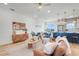 Cozy living room and open kitchen space with hardwood flooring, modern furnishings, and stylish decor elements at 3496 Amberjack Dr, Hernando Beach, FL 34607