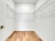 Walk-in closet with wire shelving and wood floors at 3496 Amberjack Dr, Hernando Beach, FL 34607