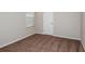 Comfortable bedroom with neutral carpet and a door at 37214 Sagemoor Dr, Zephyrhills, FL 33541