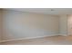 Spacious living room featuring laminated floors and natural light at 37214 Sagemoor Dr, Zephyrhills, FL 33541