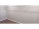 Spacious walk-in closet with ample shelving and carpet flooring at 37214 Sagemoor Dr, Zephyrhills, FL 33541