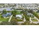 Waterfront home with lush lawn, tropical landscaping, boat dock and easy water access at 424 Island Cay Way, Apollo Beach, FL 33572