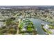 Waterfront property showcasing private boat dock, lush landscaping, surrounded by a friendly community at 424 Island Cay Way, Apollo Beach, FL 33572