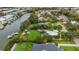 A waterfront property boasting a large yard, mature landscaping and convenient boat dock access at 424 Island Cay Way, Apollo Beach, FL 33572
