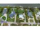 An aerial view of the home, highlighting the pool, lush backyard, and proximity to other neighborhood properties at 424 Island Cay Way, Apollo Beach, FL 33572