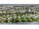 Waterfront home with boat dock and lush landscaping with a view of the community at 424 Island Cay Way, Apollo Beach, FL 33572